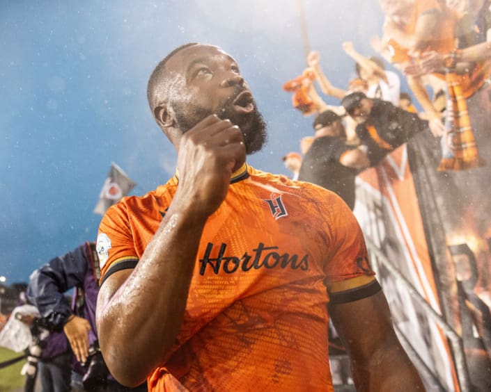 HAMILTON, ON – JUL. 10, 2024: Jordan Hamilton of Forge FC celebrates with the Barton Street Battalion after a 2-1 win over Toronto FC during Canadian Championship semi-final action.